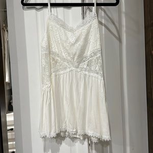 White, lace, flowy, spaghetti strap top. Never worn.